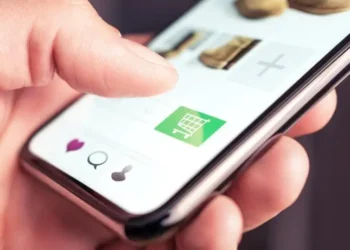 image of a phone in hand scrolling through online marketplace