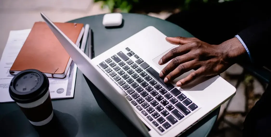 black businessman typing on laptop