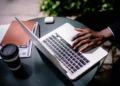 black businessman typing on laptop